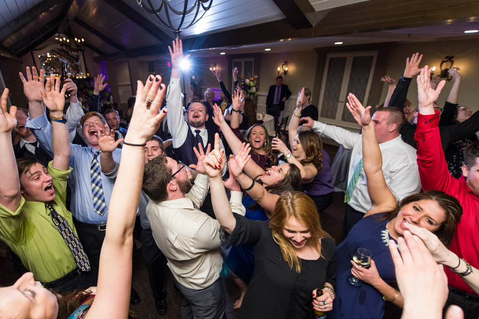 A group of people that are standing up in the air A group of people that are standing up in the air