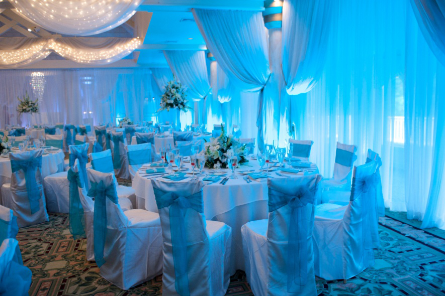 A room with many tables and chairs in it A room with many tables and chairs in it