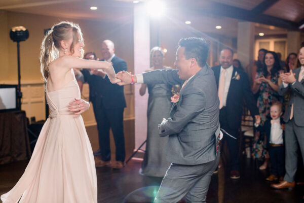 A man and woman dancing at their wedding.