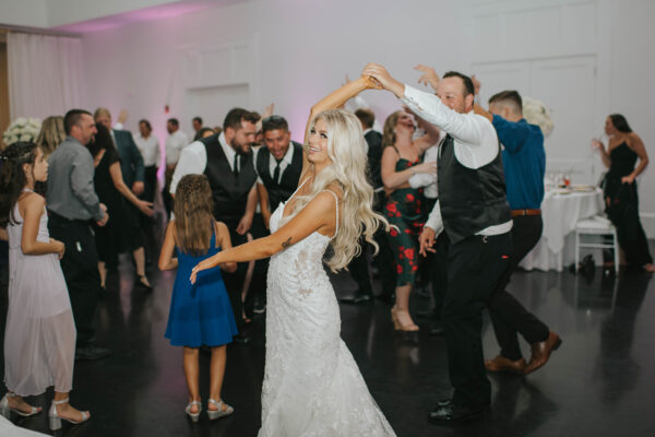 A bride and groom dancing at their wedding.