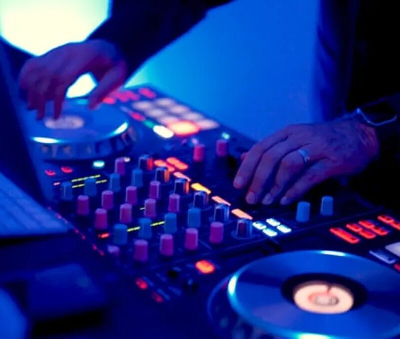 A person is playing some music on the dj decks