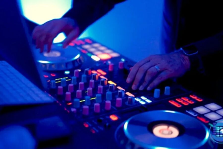 A person is playing some music on the dj decks