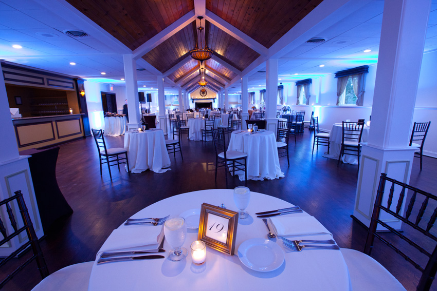 A table with a number 1 9 on it in the middle of a room. A table with a number 1 9 on it in the middle of a room.