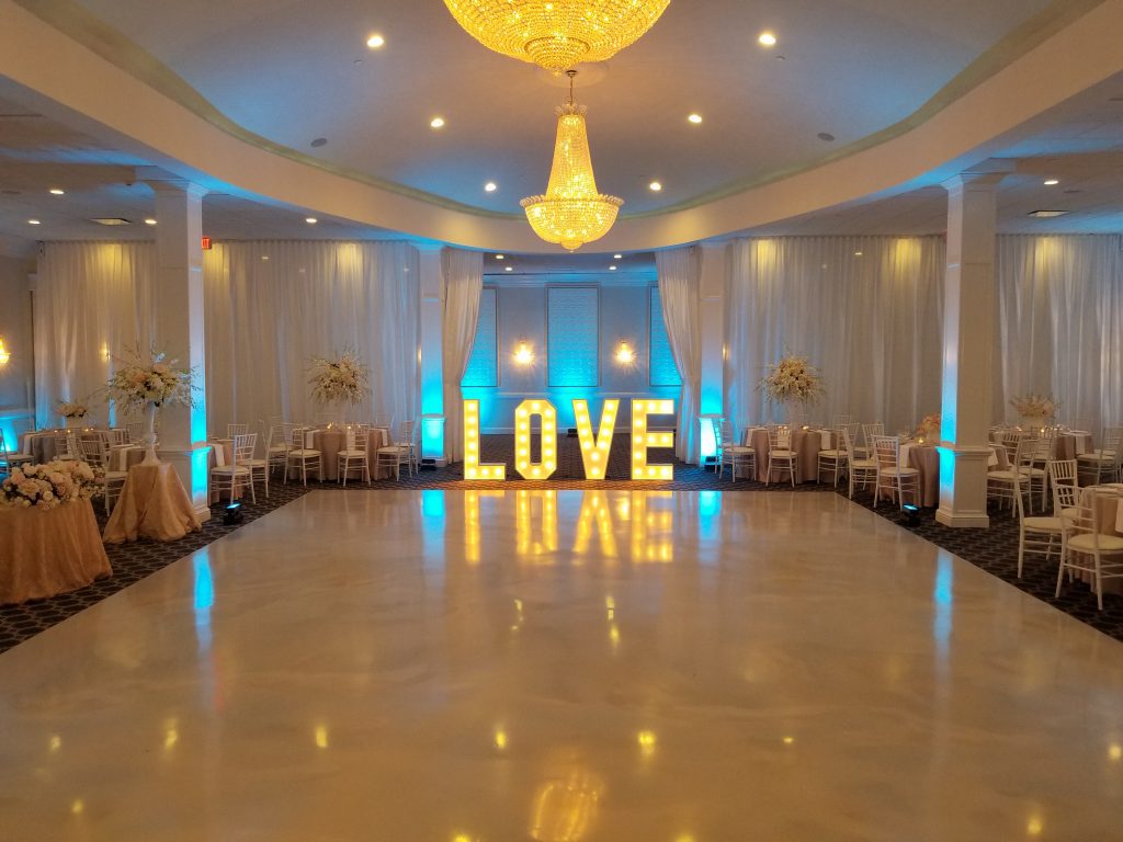 A large room with a big love sign on the floor A large room with a big love sign on the floor