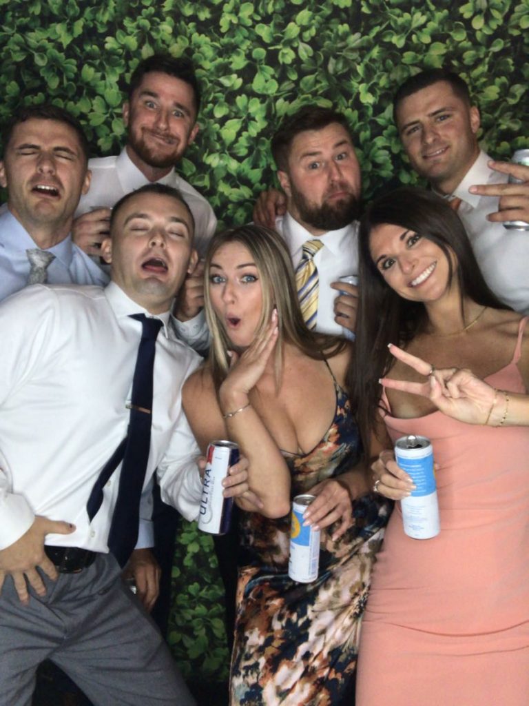 A group of people posing for the camera. A group of people posing for the camera.