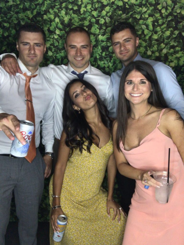 A group of people posing for the camera. A group of people posing for the camera.