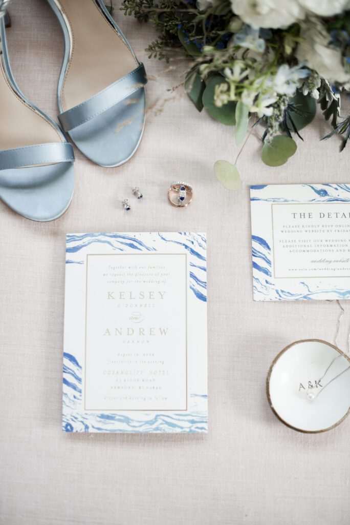 Elegant wedding invitation suite with blue marbled design and accessories. Elegant wedding invitation suite with blue marbled design and accessories.