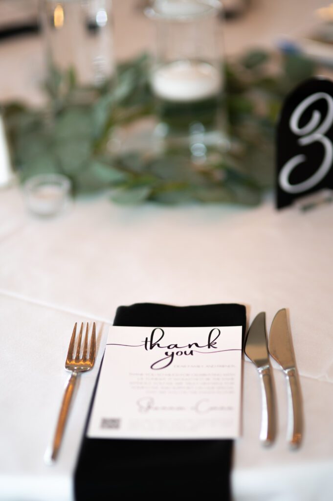 Elegant thank you card at a formal table setting. Elegant thank you card at a formal table setting.