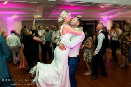 A bride and groom dancing at their wedding.