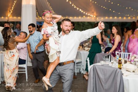 A man and woman dancing at an event.