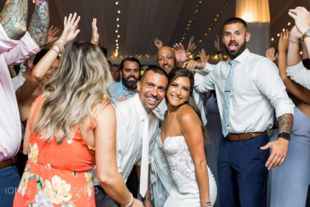 A group of people standing around each other.