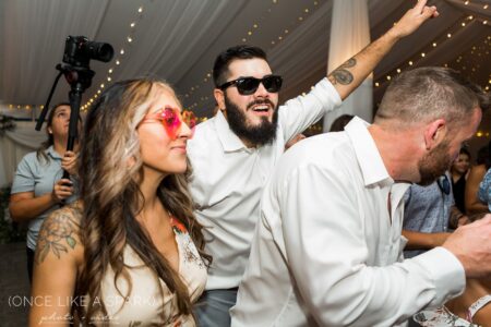A man and woman are dancing at an event.