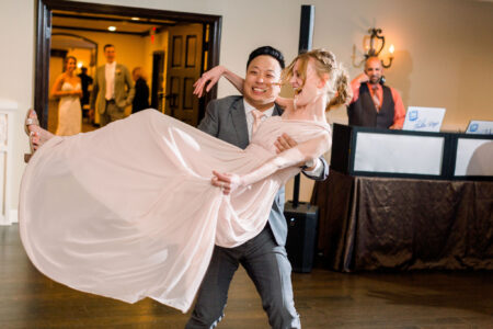 A man and woman dancing in front of a crowd.