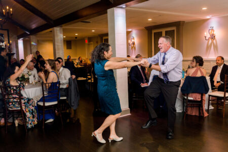 A man and woman dancing in front of an audience.