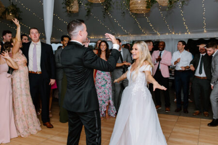 A man and woman dancing in front of a crowd.