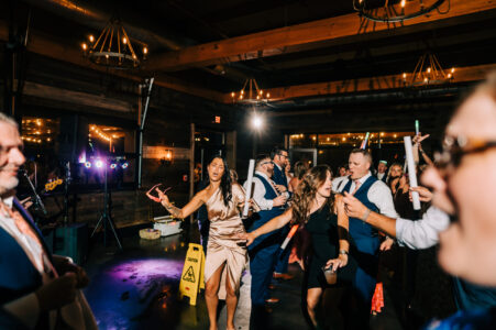 A group of people dancing in front of a crowd.