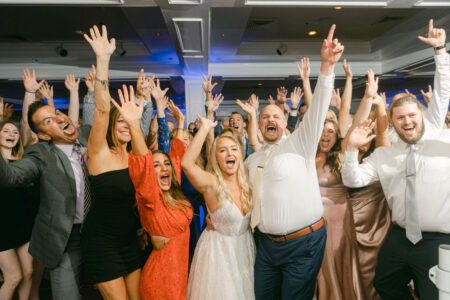 A group of people standing around each other.