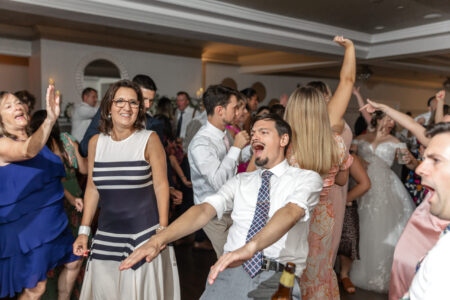 A group of people dancing at an event.