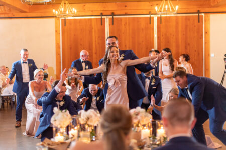 A bride and groom are dancing at their wedding.
