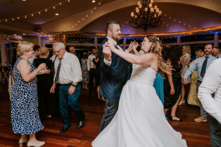 A bride and groom dancing at their wedding.
