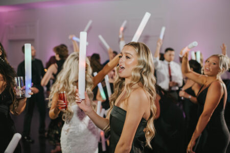 A group of people dancing in a room.