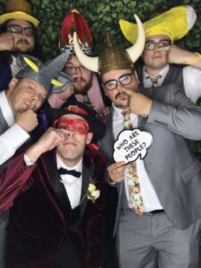A group of men wearing hats and posing for a picture.