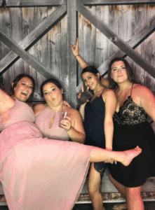 A group of women posing for the camera.
