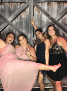 A group of women posing for the camera.