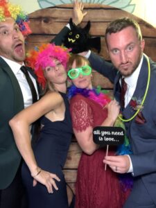 A group of people posing for a photo booth.