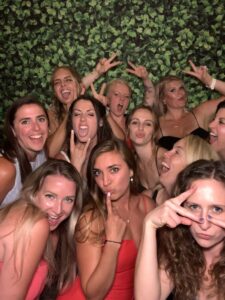 A group of women posing for the camera.