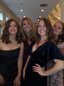 A group of women standing next to each other.